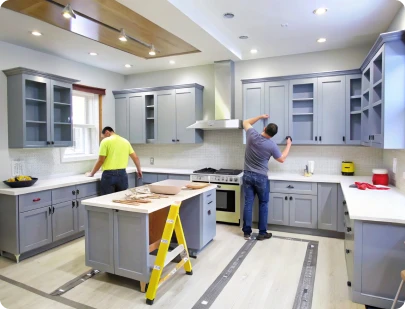 Contractors installing custom kitchen cabinetry